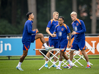 Netherlands player Tijjani Reijnders, Netherlands player Justin Kluivert, and Netherlands player Jan Paul van Hecke during the training and...