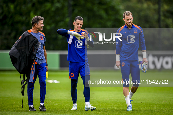 Netherlands goalkeeper trainer Patrick Lodewijks, Netherlands goalkeeper Nick Olij, and Netherlands goalkeeper Mark Flekken during the train...