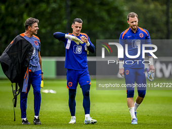 Netherlands goalkeeper trainer Patrick Lodewijks, Netherlands goalkeeper Nick Olij, and Netherlands goalkeeper Mark Flekken during the train...