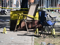 View of the crime scene with evidence markers placed on the ground. The NYPD says in an update that one person is killed and four other peop...