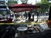 View of the crime scene with evidence markers placed on the ground. The NYPD says in an update that one person is killed and four other peop...