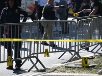 View of the crime scene with evidence markers placed on the ground. The NYPD says in an update that one person is killed and four other peop...