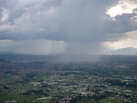 Rainfall over Kathmandu Valley as seen from Nagarkot in Kathmandu, Nepal, on October 5, 2023. (