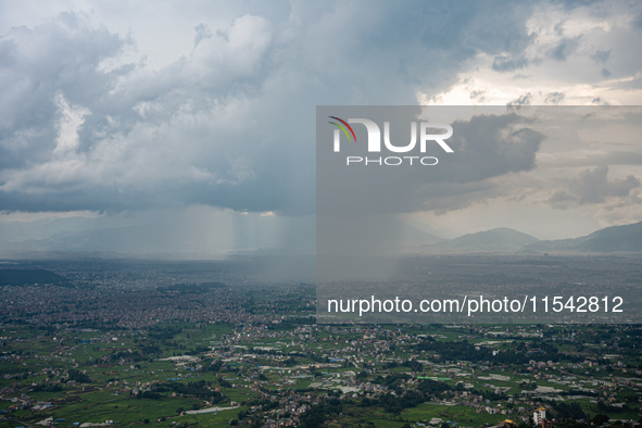 Rainfall over Kathmandu Valley as seen from Nagarkot in Kathmandu, Nepal, on October 5, 2023. 