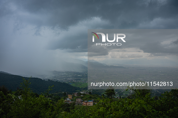 Rainfall over Kathmandu Valley as seen from Nagarkot in Kathmandu, Nepal, on October 5, 2023. 