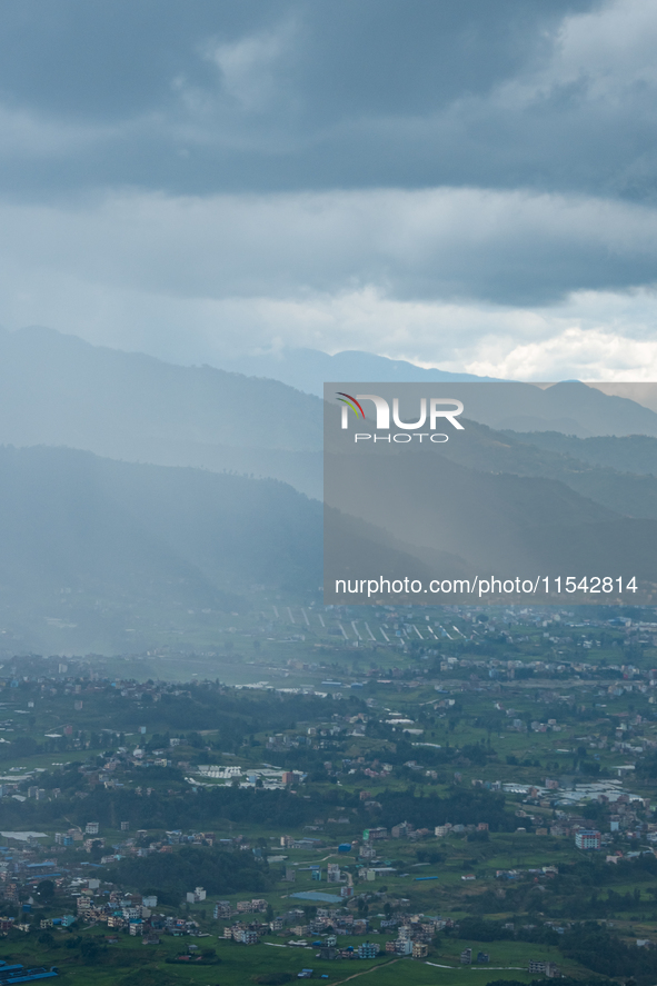 Rainfall over Kathmandu Valley as seen from Nagarkot in Kathmandu, Nepal, on October 5, 2023. 