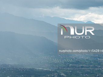 Rainfall over Kathmandu Valley as seen from Nagarkot in Kathmandu, Nepal, on October 5, 2023. (