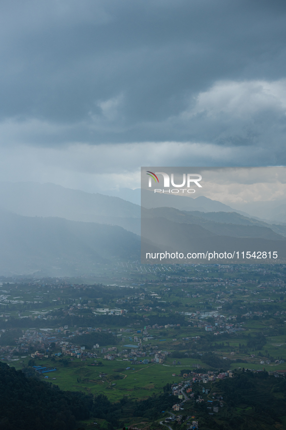 Rainfall over Kathmandu Valley as seen from Nagarkot in Kathmandu, Nepal, on October 5, 2023. 