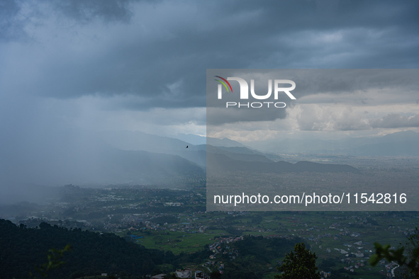 Rainfall over Kathmandu Valley as seen from Nagarkot in Kathmandu, Nepal, on October 5, 2023. 