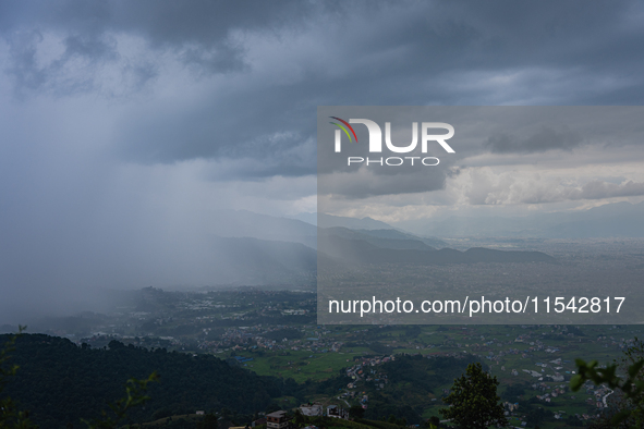 Rainfall over Kathmandu Valley as seen from Nagarkot in Kathmandu, Nepal, on October 5, 2023. 