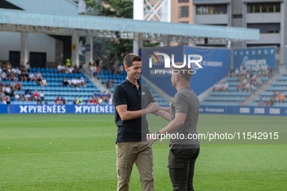 In Andorra La Vella, Andorra, on August 31, 2024, Ferran Costa, coach of FC Andorra, and Albert Sanchez, coach of FC Barcelona Atletic, are...