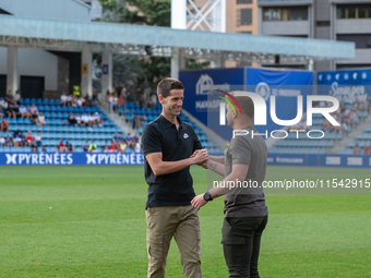 In Andorra La Vella, Andorra, on August 31, 2024, Ferran Costa, coach of FC Andorra, and Albert Sanchez, coach of FC Barcelona Atletic, are...