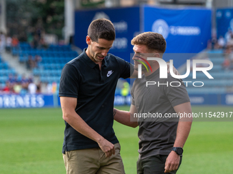 In Andorra La Vella, Andorra, on August 31, 2024, Ferran Costa, coach of FC Andorra, and Albert Sanchez, coach of FC Barcelona Atletic, are...