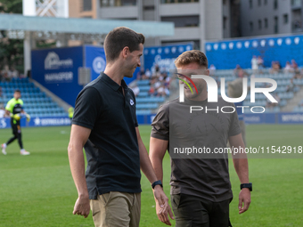 In Andorra La Vella, Andorra, on August 31, 2024, Ferran Costa, coach of FC Andorra, and Albert Sanchez, coach of FC Barcelona Atletic, are...