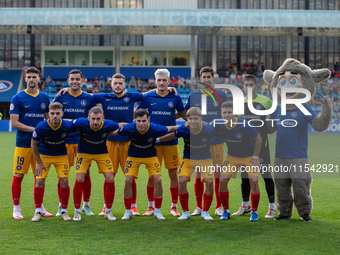 In Andorra La Vella, Andorra, on August 31, 2024, FC Andorra players form during the Primera RFEF 2024-2025 match between FC Andorra and FC...