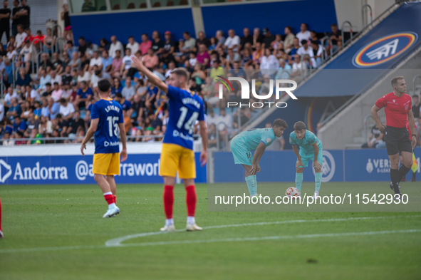 Players are in action during the Primera RFEF 2024-2025 match between FC Andorra and FC Barcelona Atletic at Estadi Nacional d'Andorra in An...