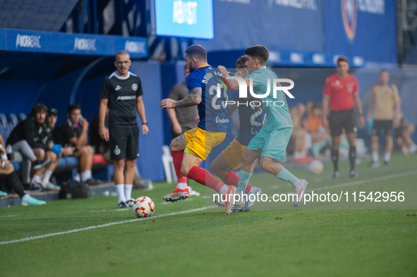 Players are in action during the Primera RFEF 2024-2025 match between FC Andorra and FC Barcelona Atletic at Estadi Nacional d'Andorra in An...