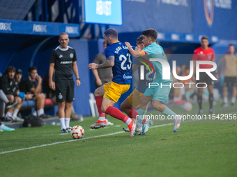 Players are in action during the Primera RFEF 2024-2025 match between FC Andorra and FC Barcelona Atletic at Estadi Nacional d'Andorra in An...