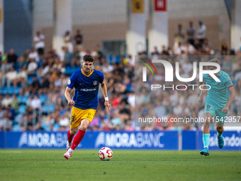 Almpanis is in action during the Primera RFEF 2024-2025 match between FC Andorra and FC Barcelona Atletic at Estadi Nacional d'Andorra in An...