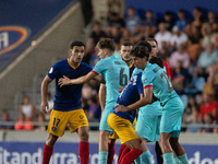 Players are in action during the Primera RFEF 2024-2025 match between FC Andorra and FC Barcelona Atletic at Estadi Nacional d'Andorra in An...