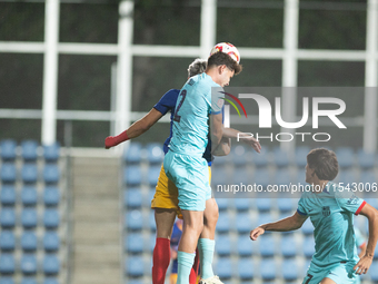 Players are in action during the Primera RFEF 2024-2025 match between FC Andorra and FC Barcelona Atletic at Estadi Nacional d'Andorra in An...