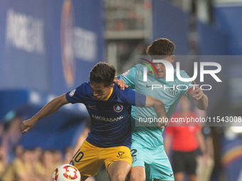 In Andorra La Vella, Andorra, on August 31, 2024, Alvaro Martin of FC Andorra and Trilli of FC Barcelona Atletic are in action during the Pr...