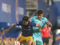 In Andorra La Vella, Andorra, on August 31, 2024, Alvaro Martin of FC Andorra and Trilli of FC Barcelona Atletic are in action during the Pr...