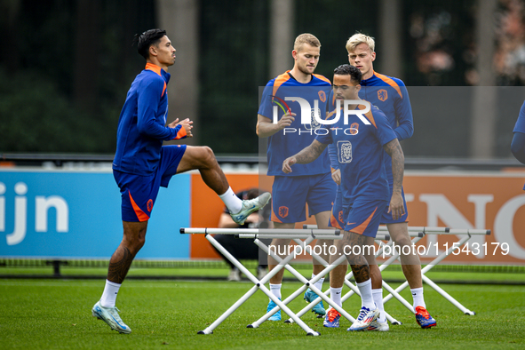 Netherlands players Tijjani Reijnders, Justin Kluivert, Matthijs de Ligt, and Jan Paul van Hecke during the training and press conference fo...