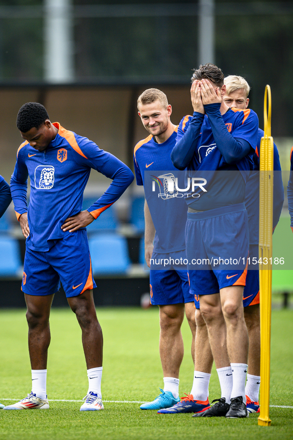 Netherlands players Denzel Dumfries, Matthijs de Ligt, and Wout Weghorst during the training and press conference for the Netherlands Nation...