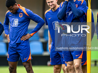 Netherlands players Denzel Dumfries, Matthijs de Ligt, and Wout Weghorst during the training and press conference for the Netherlands Nation...