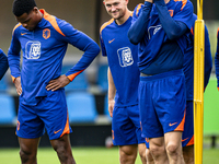 Netherlands players Denzel Dumfries, Matthijs de Ligt, and Wout Weghorst during the training and press conference for the Netherlands Nation...