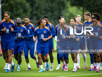 Netherlands players Virgil van Dijk, Brian Brobbey, Nathan Ake, Justin Kluivert, and Jurrien Timber during the training and press conference...