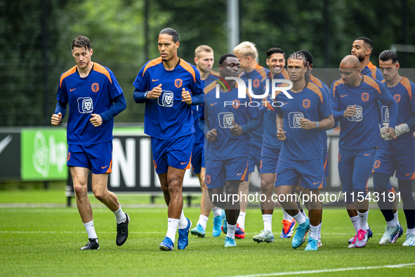 Netherlands players Wout Weghorst, Virgil van Dijk, Brian Brobbey, Nathan Ake, and Donyell Malen during the training and press conference fo...