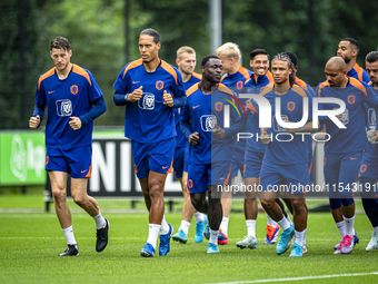 Netherlands players Wout Weghorst, Virgil van Dijk, Brian Brobbey, Nathan Ake, and Donyell Malen during the training and press conference fo...