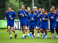 Netherlands players Wout Weghorst, Virgil van Dijk, Brian Brobbey, Nathan Ake, and Donyell Malen during the training and press conference fo...