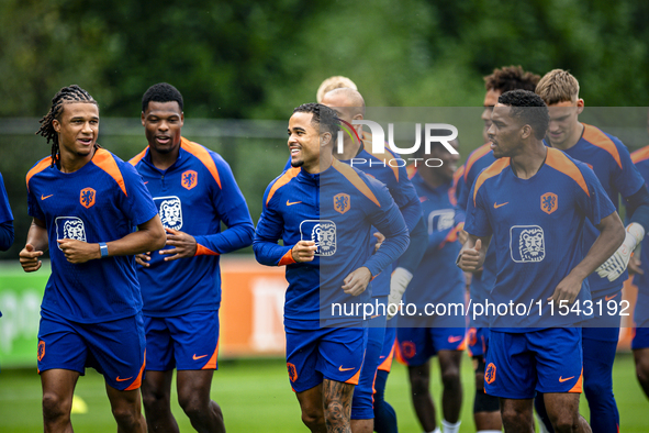 Netherlands players Nathan Ake, Justin Kluivert, and Jurrien Timber during the training and press conference for the Netherlands Nations Lea...