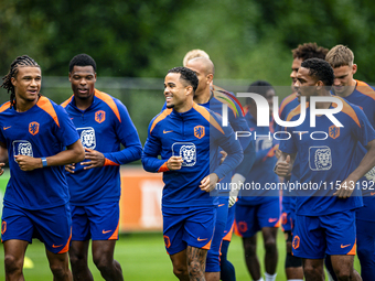 Netherlands players Nathan Ake, Justin Kluivert, and Jurrien Timber during the training and press conference for the Netherlands Nations Lea...