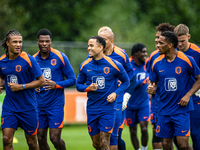 Netherlands players Nathan Ake, Justin Kluivert, and Jurrien Timber during the training and press conference for the Netherlands Nations Lea...