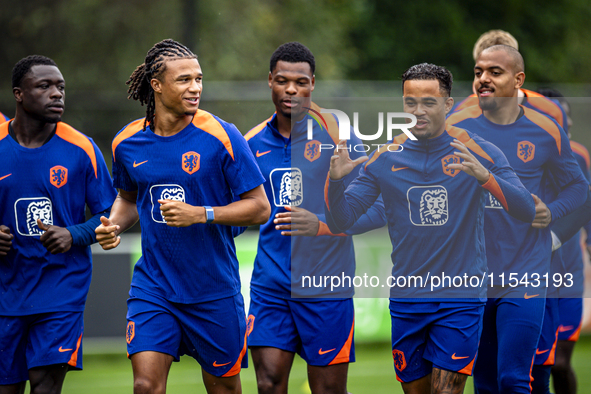 Netherlands players Brian Brobbey, Nathan Ake, Denzel Dumfries, and Justin Kluivert participate in training and a press conference at the KN...