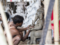 Artisans work on idols of the elephant-headed Hindu deity Ganesha at a workshop ahead of the Ganesh Chaturthi festival in Guwahati, Assam, I...