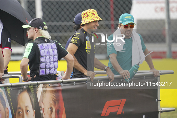 Fernando Alonso and Carlos Sainz Jr. participate in the driver parade during the Formula 1 Pirelli Gran Premio d'Italia 2024 in Monza, Italy...