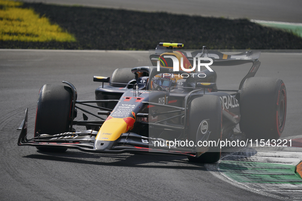 Sergio Perez of Mexico drives the (11) Oracle Red Bull Racing RB20 Honda RBPT during the race of the Formula 1 Pirelli Gran Premio d'Italia...