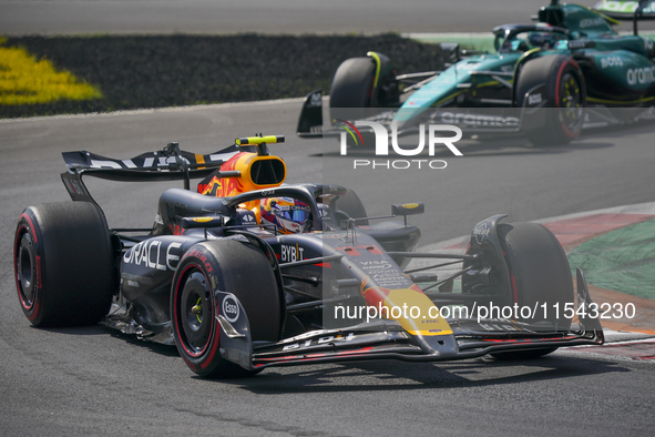 Sergio Perez of Mexico drives the (11) Oracle Red Bull Racing RB20 Honda RBPT during the race of the Formula 1 Pirelli Gran Premio d'Italia...