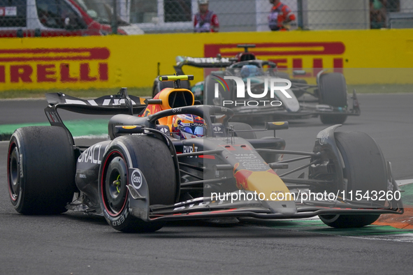 Sergio Perez of Mexico drives the (11) Oracle Red Bull Racing RB20 Honda RBPT during the race of the Formula 1 Pirelli Gran Premio d'Italia...