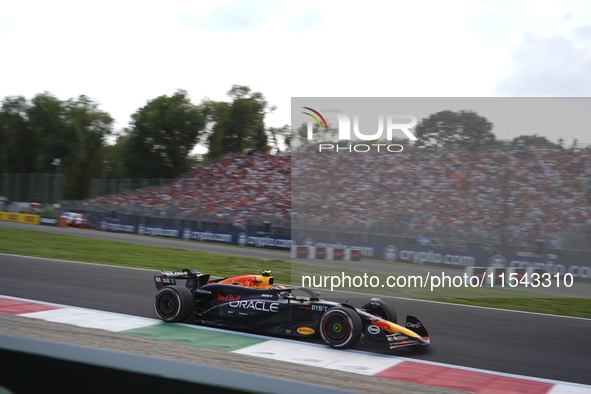 Sergio Perez of Mexico drives the (11) Oracle Red Bull Racing RB20 Honda RBPT during the race of the Formula 1 Pirelli Gran Premio d'Italia...