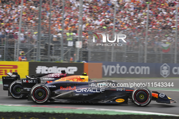 Sergio Perez of Mexico drives the (11) Oracle Red Bull Racing RB20 Honda RBPT during the race of the Formula 1 Pirelli Gran Premio d'Italia...