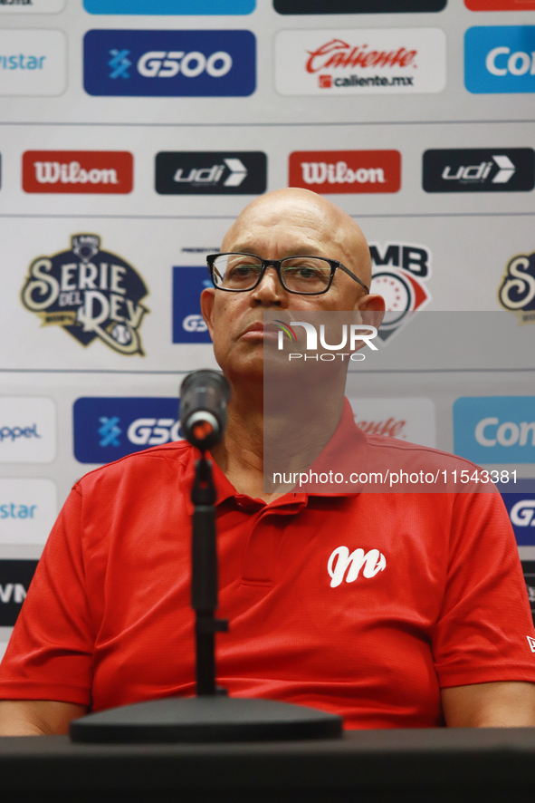 Lorenzo Bundy, manager of the Diablos Rojos of Mexico, speaks during a press conference to announce his pitching rotation to face Sultanes d...