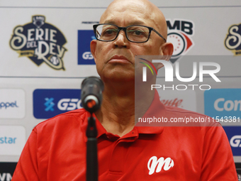 Lorenzo Bundy, manager of the Diablos Rojos of Mexico, speaks during a press conference to announce his pitching rotation to face Sultanes d...