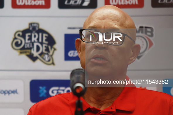 Lorenzo Bundy, manager of the Diablos Rojos of Mexico, speaks during a press conference to announce his pitching rotation to face Sultanes d...