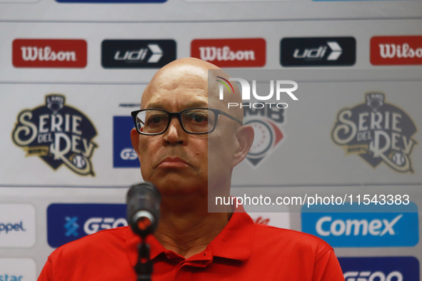 Lorenzo Bundy, manager of the Diablos Rojos of Mexico, speaks during a press conference to announce his pitching rotation to face Sultanes d...